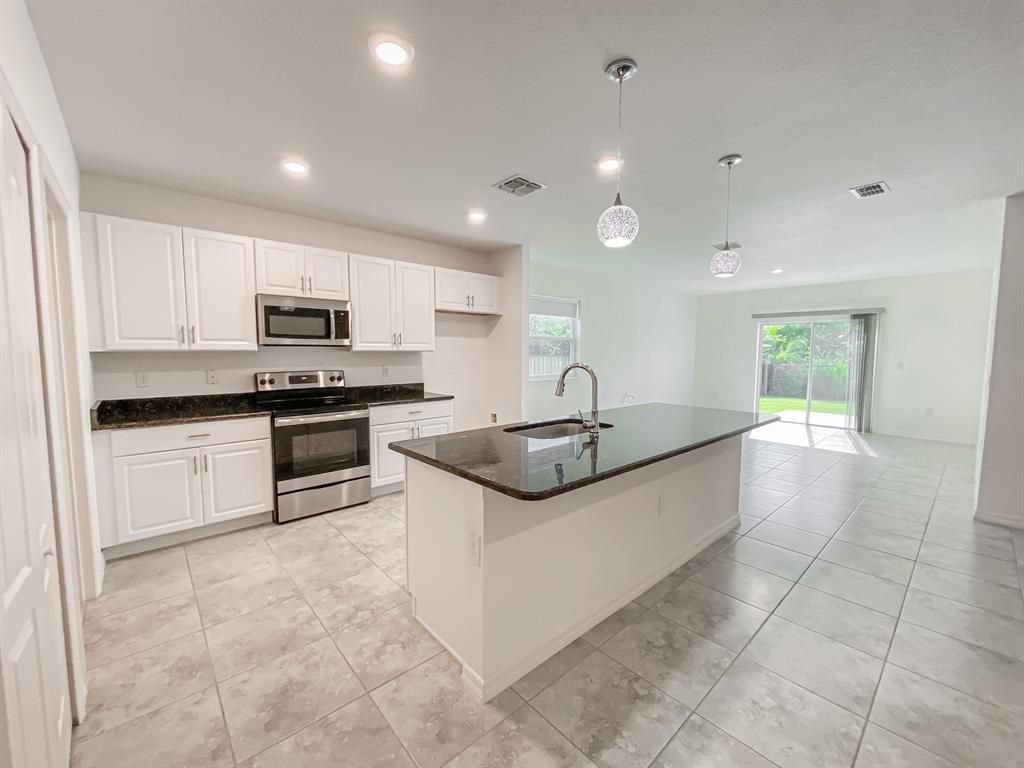 Photo of 2042 SW Aguero Street, Port Saint Lucie, FL 34953 (MLS # R10743568)