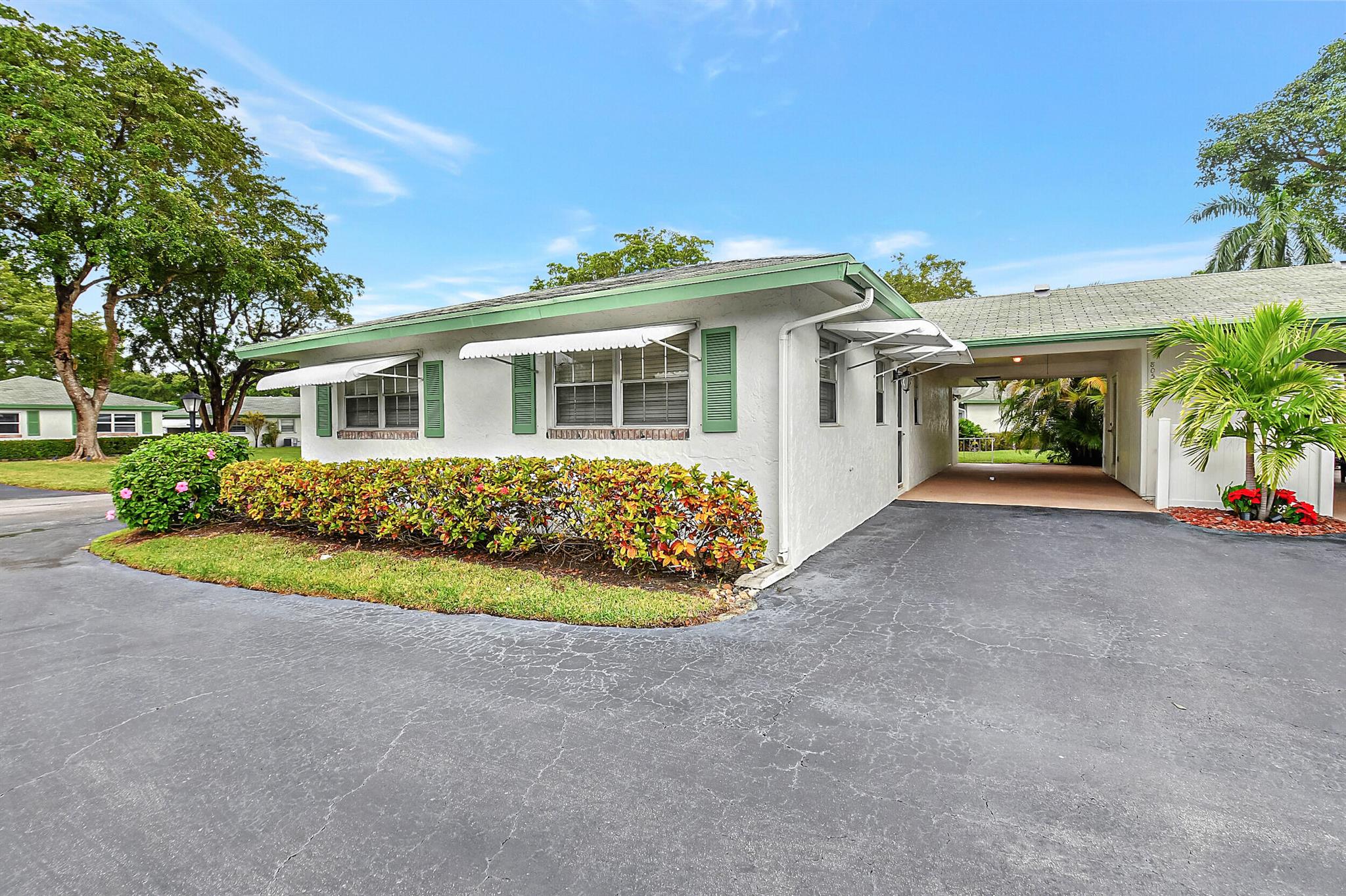 Nicely updated unit with plenty of storage space, carport, newer A/C, separate washer and dryer room.