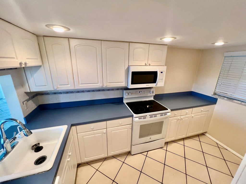 Photo of 9450 Poinciana Place #416, Davie, FL 33324 (MLS # B26078387)