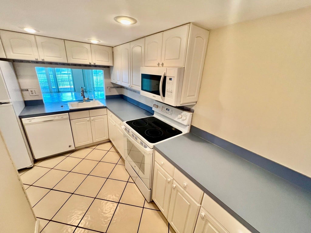 Photo of 9450 Poinciana Place #416, Davie, FL 33324 (MLS # B26078387)