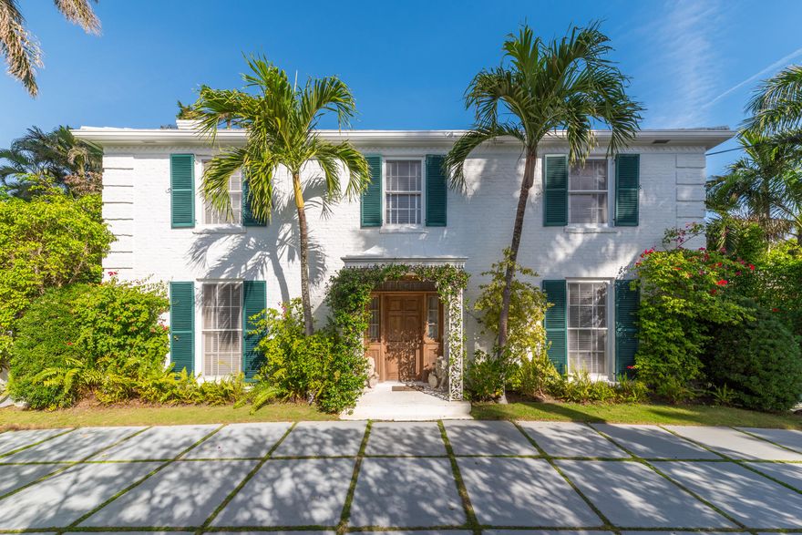 Traditional white brick colonial 2 story home overlooking the Breakers Golf Course that is full of natural light. Formal foyer with a circular staircase, living room with floor to ceiling windows, fireplace and opens to a large sun filled logia. There is a formal dining room and the kitchen has an eat in area, butler's pantry and ready for an update. The master bedroom has a his and hers bathroom and a study, all other 3 bedrooms have private bathrooms. The pool is wonderful with a fountain and located off a covered patio. The garden has mature trees, fenced in yard that creates a lush private tropical setting.