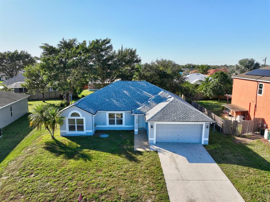 Photo of 4240 SW Callicoe Street, Port St Lucie, FL 34953 (MLS # R10856471)