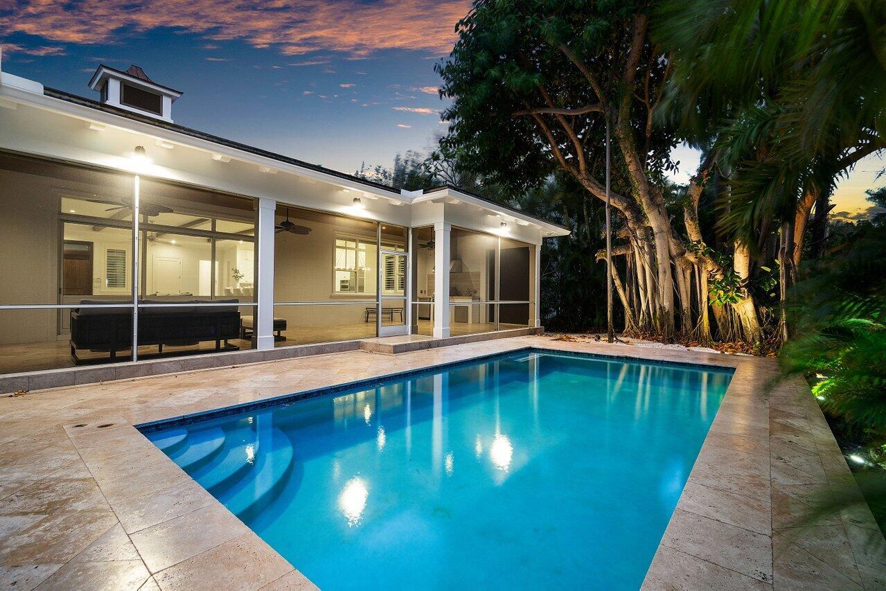 Stunning Luxury Home on Hypoluxo Island. Nestled on the prestigious Hypoluxo Island, this exquisite 3-bedroom, 3-bathroom luxury home, built by the renowned Farrell Building Company, offers 2,600 square feet of elegantly designed living space. With its expansive open floor plan, high ceilings, and top-tier finishes, this residence is the perfect blend of sophistication and comfort. Enjoy seamless indoor-outdoor living with a gorgeous saltwater pool, ideal for relaxing or entertaining, surrounded by lush landscaping. The home features oversized moldings, solid core doors, and fine finishes throughout, showcasing the craftsmanship and attention to detail that Farrell Building Company is known for. For added peace of mind, the property also includes a Generac generator. Located just over