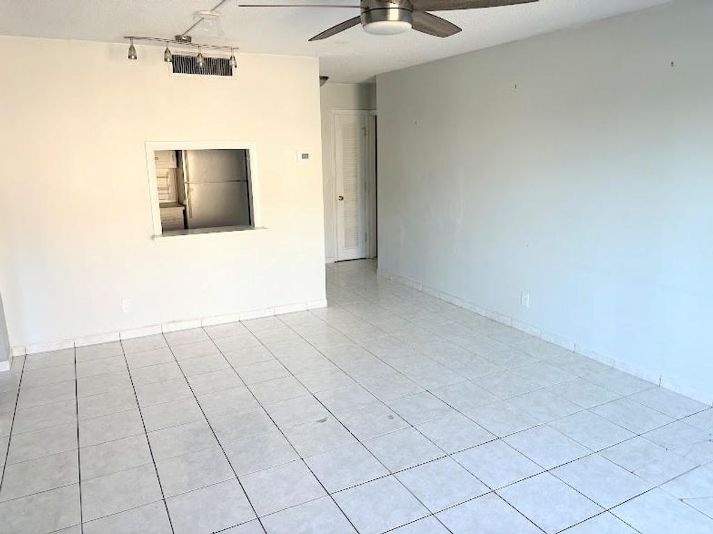 Photo of 660 Tennis Club Dr #306, Fort Lauderdale, FL 33311 (MLS # F10533289)