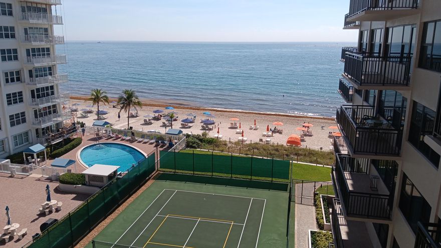 Stunning ocean views from this completely remodled 2 BR 2 bath unit .   Decorate to your dream oceanfront hacienda! 36 inch white tiles and two brand new baths make this your blank canvas to create your dream! Plenty of closets and storage. All new appliances in a luxury oceanfront building with beach umbrellas ,hot tub, heated pool and many luxury amenities.  Across the street from  supermarket and shopping- This has it all!! Easy to show.