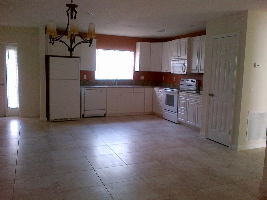 Spacious first floor condo with over 1640 sq. ft. of living space. condo is completely tiles , open floor plan with granite counter tops, 42 in custom cabinets, includes all appliances. separate screened covered patio and separate laundry room with full size washer and dryer. accordion shutter. Community offers pool, fitness center, spa, tennis all close to US 1, civic center, hospital, mall and more
