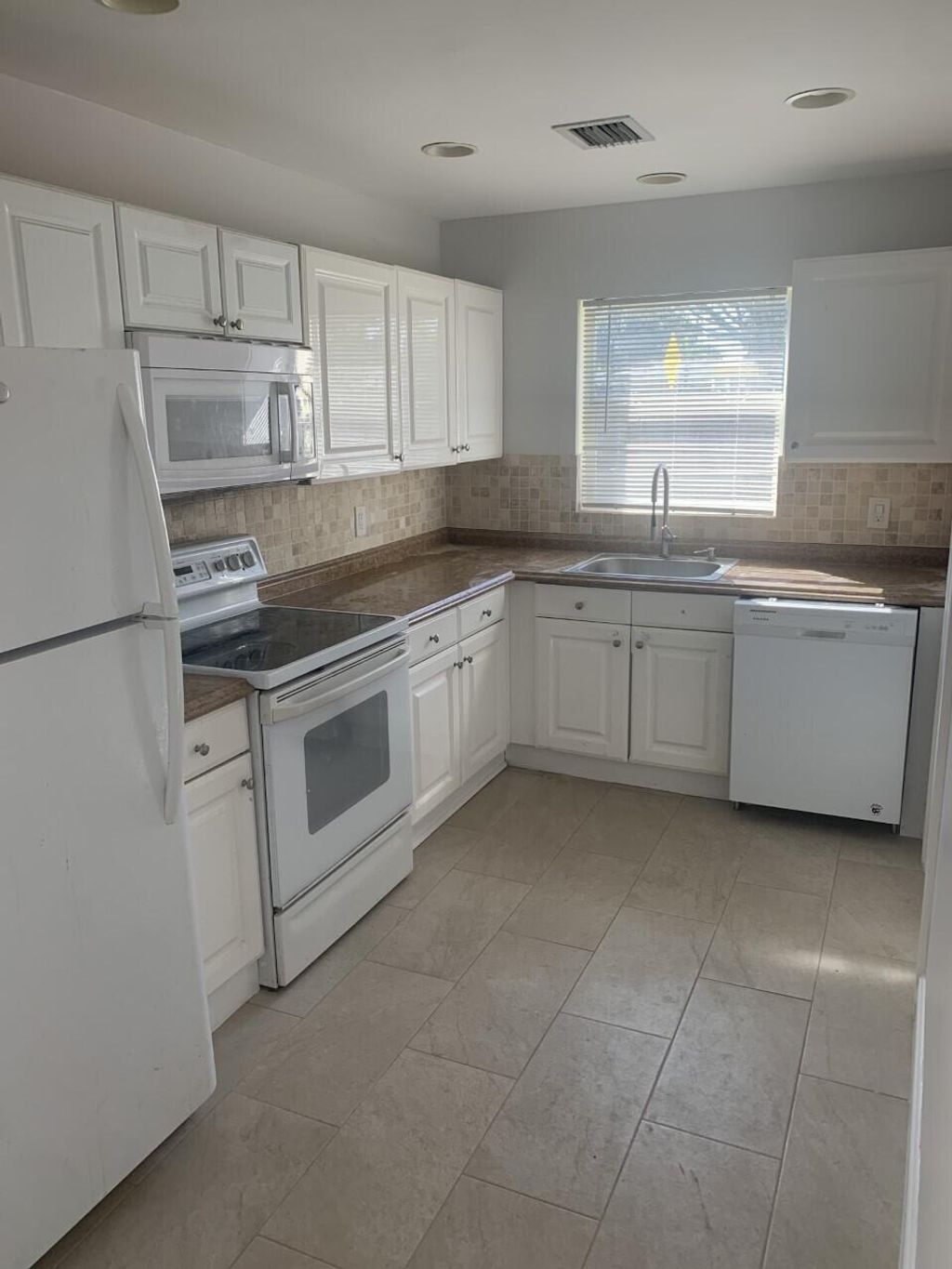 Photo of 12173 Colony Avenue, Palm Beach Gardens, FL 33410 (MLS # R11092747)