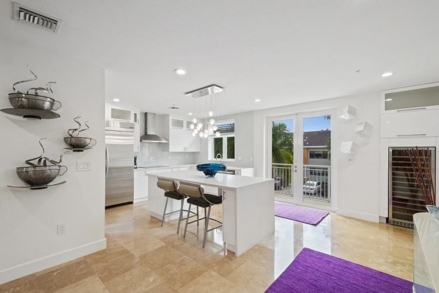 OWNER WILL CONSIDER SHORT TERM RENTALS. Waterfront townhouse with private dock for up to a 55’ boat. Direct ocean access with no fixed bridges. Beautifully renovated inside and out. Walk one way to all your favorite restaurants on Las Olas Blvd, walk the other way to the beach. Enjoy amazing waterfront views from three balconies and a rooftop terrace. Gourmet kitchen, high end appliances, Large master bedroom with 2 large walk- in closets. Each of the 4 bedrooms have an ensuite bathroom. High ceilings, impact windows and doors, marble and wood floors throughout, loft, den, 2 car garage, designer elevator. Professionally designed, fully furnished interior. OWNER WILL CONSIDER SHORT TERM RENTALS