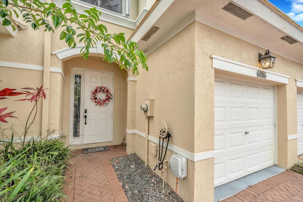 Photo of 6086 Seminole Gardens Circle, Riviera Beach, FL 33418 (MLS # R11097265)
