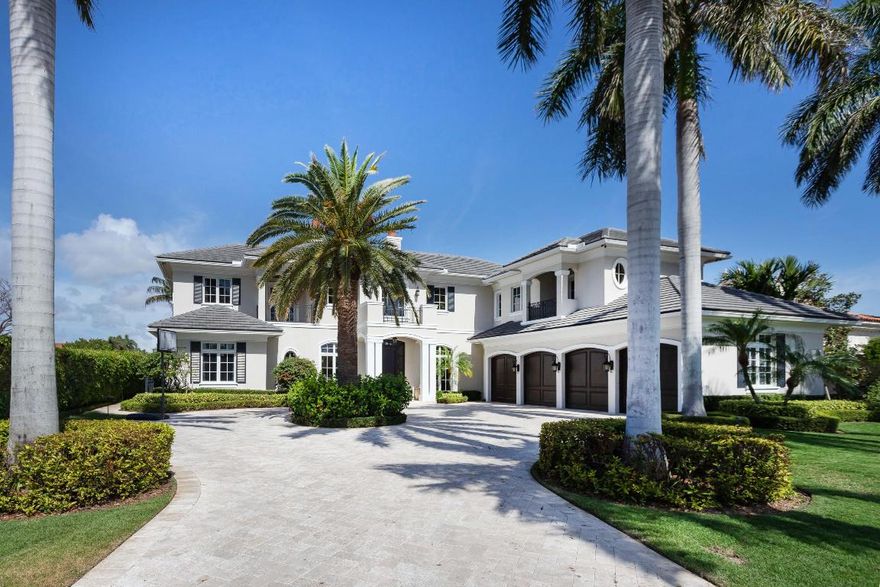 you'll find ample parking on the extended circular drive as well as in the air-conditioned 4 bay garage.  Overlooking the canal, you'll enjoy outdoor patio space with an extensive summer kitchen, upstairs and downstairs outdoor fireplaces, an outdoor shower, infinity pool with graduated "beach" entrance and separate spa.