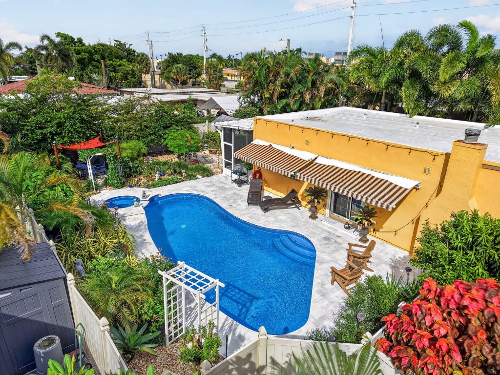 Photo of 415 Colonial Road, West Palm Beach, FL 33405 (MLS # B26084212)