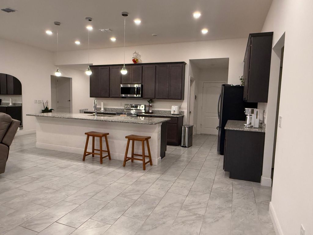 Photo of 878 SW Haas Avenue, Port Saint Lucie, FL 34953 (MLS # R11149635)