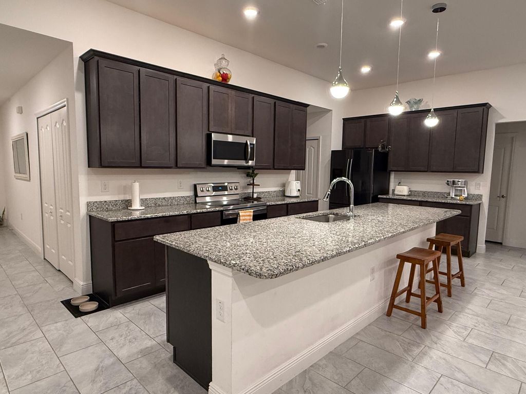 Photo of 878 SW Haas Avenue, Port Saint Lucie, FL 34953 (MLS # R11149635)