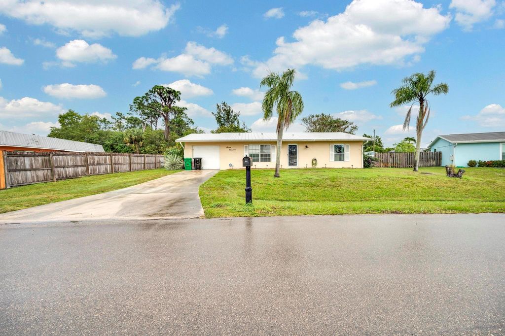 Photo of 719 NE Perch Lane, Port Saint Lucie, FL 34983 (MLS # R10954441)