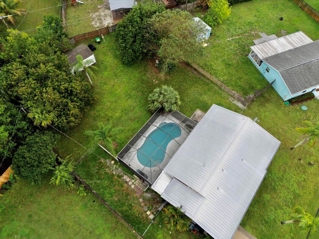 Photo of 719 NE Perch Lane, Port Saint Lucie, FL 34983 (MLS # R10954441)