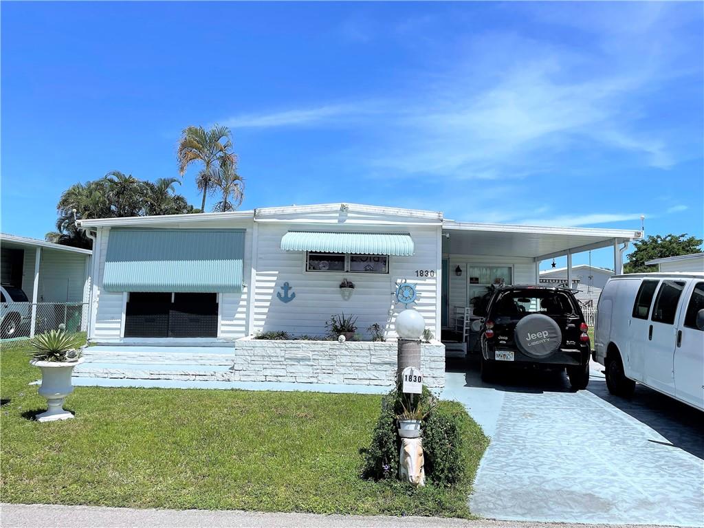 Nice size 2/2 with enclosed patio and push out - -PLEASE overlook all the stuff inside as it will all be removed prior to closing - carport - three sheds - - on oversized lot in Sec 3 - -assoc. states it is HOPA verified - --
