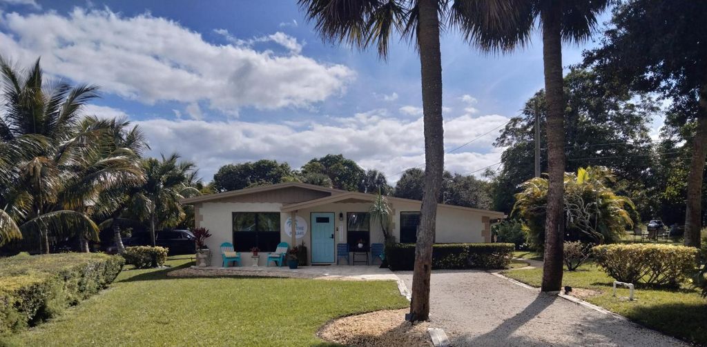 Photo of 1150 NE County Line Road, Jensen Beach, FL 34957 (MLS # R11142637)