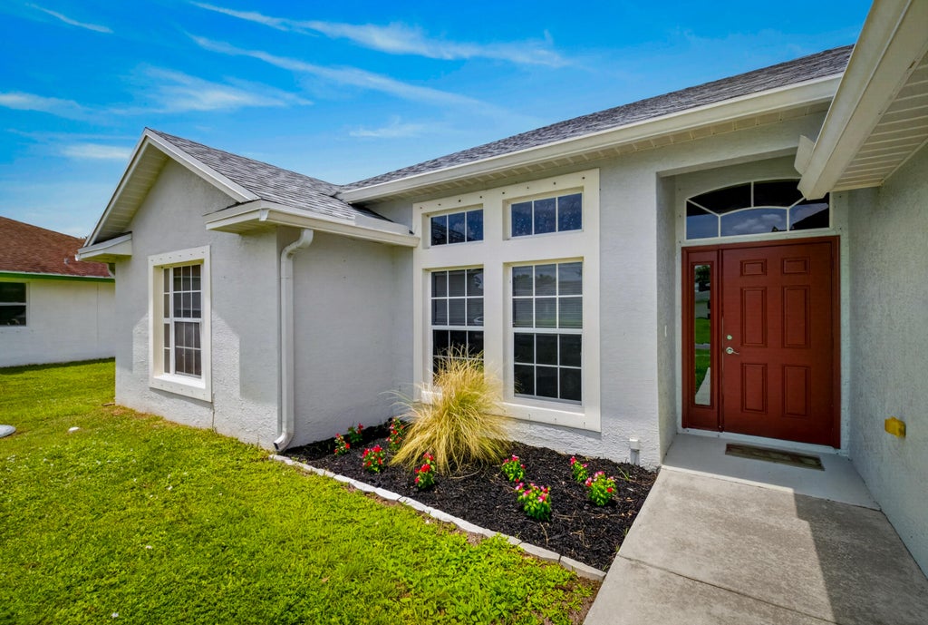 Photo of 2325 SW SALMON Road, Port Saint Lucie, FL 34953 (MLS # B26059385)