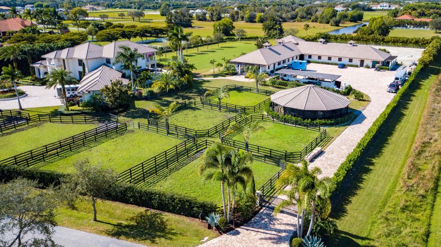 One of the best locations in all of Palm Beach Point! A professional's training facility and a luxurious dream home made for entertaining! This magnificent private 6 acre equestrian estate was originally constructed in 2011 and just renovated in the Fall of 2020. Fully equipped equestrian features paired with lavish luxury living, all just a few minutes hack to WEF, make this farm one of Wellington's crown jewels. The barn has a gorgeous rider's lounge with a pergola-covered viewing terrace, and is complete with an upstairs 2 bedroom, 1 bath grooms quarter with a full kitchen and living room.
The 2 level, custom built main house boasts 5 bedrooms + an office + media room, 8 bathrooms and a 5 car garage. The massive driveway and entrance, welcomes you into a beautiful foyer with high ceilings and views over the grassfield and pool area. You will see nothing but top quality finishes, high-end appliances and exceptional design choices in this house. The extravagant outdoor living spaces with an attractive pool and spa and amazing sunset views makes this impressive farm complete.

Main house:
***Available furnished***
(House Total: 9,050 sqft ; House Under Air: 5,697 sqft ; Lower Level Under Air: 3,945 ; Upper Level Under Air: 1,774)
6 bedroom + lg office, 6 full bath, 2 half bath house
5 car garage, with AC area
Master on main level
Viking refrigerator
Viking gas stove and hood
Viking wine fridge
Stunning pool/spa and outdoor entertaining spaces and an outdoor full kitchen, with grill and gas stove.
Two outside cabana bathrooms
Whole house generator
Impact glass throughout
Reverse osmosis water filtration system

Equest. Features:
(Barn Total: 9,061 sqft ; Barn Under Air: 1,250 sqft)
20-24 stall barn (two separate wings)
2 Barn Bathrooms
Large riders lounge with a full bathroom and a wrap-around elevated viewing terrace with pergola
Barn has upstairs 2 bedroom, bathroom grooms quarters with a full kitchen and living room.
2 tack rooms, 2 feed rooms, 7 paddocks
Grass jump field AND all-weather GGT arena!
Arena: 165' (50m) X 180'(55m) all-weather arena with GGT footing & full drainage.
Grass field: 105' (32m) wide x 275' (84m) long
Covered 6 Horse Walker (16m) from MK Horse Walkers.
Roll down aisle doors and window shutters, impact glass
Tongue and groove wood ceilings
Water, fans, flyspray to all of the stalls.
Separate Barn RO water filtration system