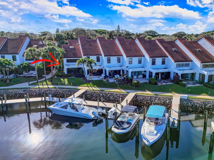 Find tranquility here. This beautiful end unit ownhome has direct waterfront and mangroves view. Light and bright, it is steps from the Iintracoastal Waterway. Mariner's Cove is an exclusive gated boating community, convenient to great shopping, restaurants and the beach. 3 Bedroom (1 downstairs)  2 full Baths, fully renovated and move-in ready. Full impact glass throughout. 2025 A/C and 2026 Washer Dryer in the unit. Lovely walkway and picnic area; community clubhouse with pool and marina views. Screened in patio for enjoying the view and breeze. Under stair storage. Turnkey and Furnishings negotiable.