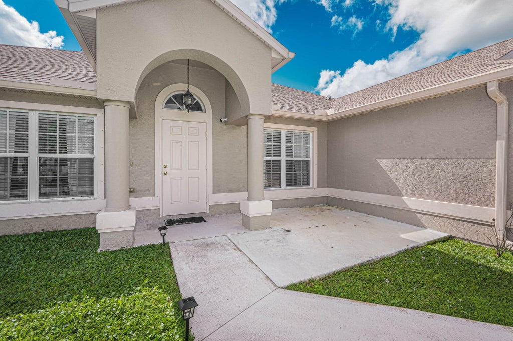 Photo of 1450 SW Leisure Lane, Port Saint Lucie, FL 34953 (MLS # R11036487)