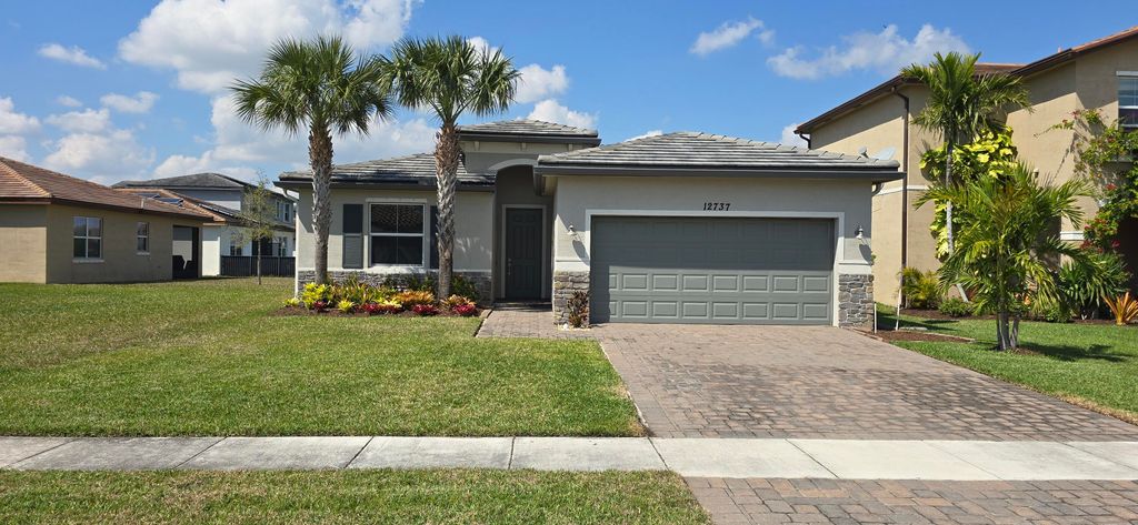 Photo of 12737 NW Milestone Place, Port Saint Lucie, FL 34987 (MLS # B26033631)