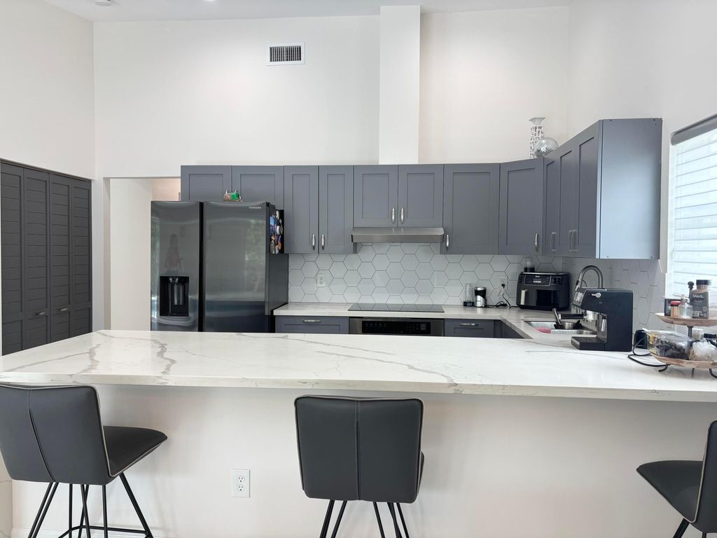 Photo of 330 Sandalwood Lane, Boca Raton, FL 33487 (MLS # B26023287)