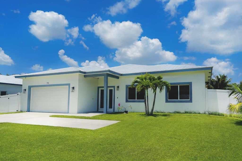 Photo of 115 SW Oakridge Drive, Port Saint Lucie, FL 34984 (MLS # R11111995)