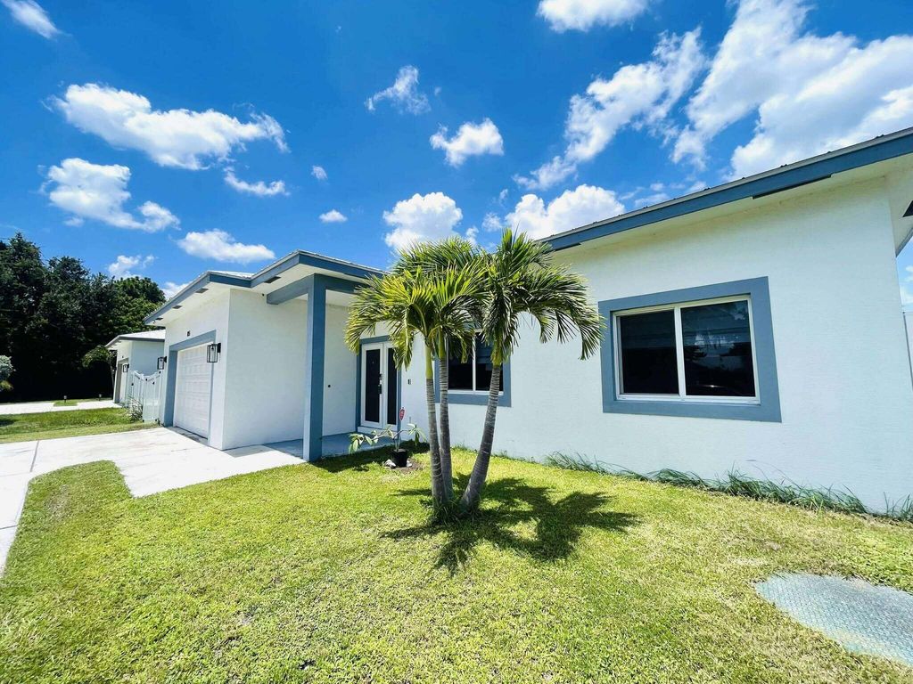 Photo of 115 SW Oakridge Drive, Port Saint Lucie, FL 34984 (MLS # R11111995)