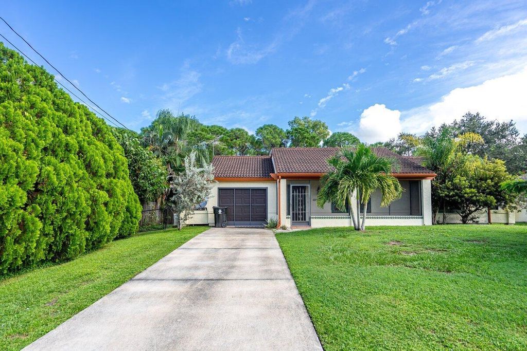 Photo of 5426 NW Clark Avenue, Port Saint Lucie, FL 34983 (MLS # R11128299)