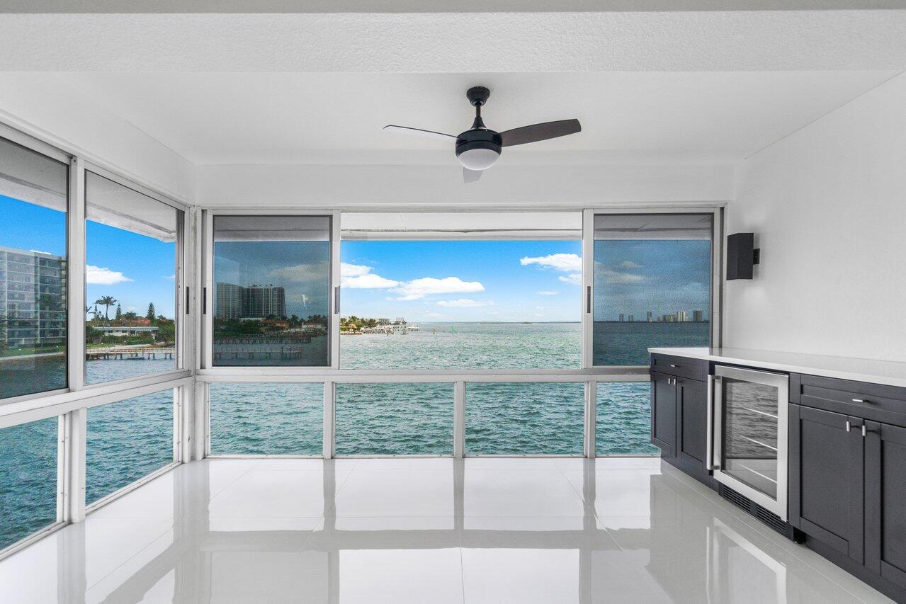 Discover refined waterfront living in this completely renovated 2-bedroom, 2-bathroom condo, perfectly situated in a quiet, gated community. This top-floor corner unit offers exceptional privacy and stunning direct views of the Intracoastal Waterway. Everything is new here and every detail has been thoughtfully updated, from the 32-inch ceramic tile flooring throughout to the elegant lighting fixtures that enhance the modern, sophisticated ambiance.The kitchen is a chef's dream, featuring soft-closing wood cabinets, Designer appliances, and beautiful granite countertops, both bathrooms have been tastefully updated with high end finishes. New Impact windows provide peace of mind and quiet comfort, With its upscale fini