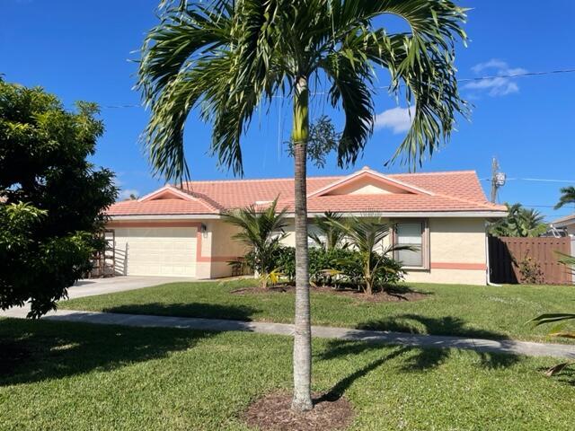 Everything brand new in this recently remodeled 4 bedroom 2 bath home in premier East Boca location....new kitchen, new bathrooms, new tile flooring throughout, indoor laundry room, all new appliances, fully fenced back yard with new screened in patio and new sod...