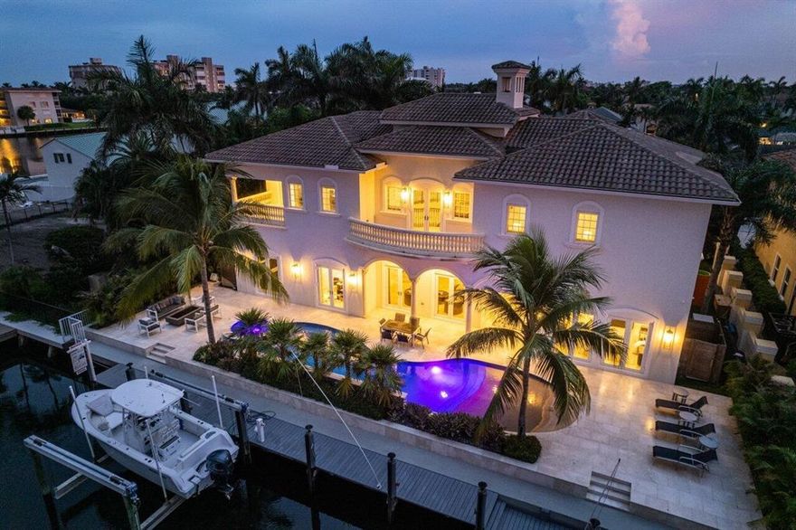 What an impression! This perfectly renovated waterfront estate in Delray Beach, FL blends transitional & modern style, creating a one-of-a-kind Yachtsman's Dream in Tropic Isle. Highlighted by its location just one lot from the point, this oversized lot features 97' of deep water frontage and a 70 foot dock w/power & 24k lb boat lift. No fixed bridges between you and the azure waters of the Atlantic Ocean. Constructed in 2008, the property was fully redesigned and remodeled in 2018. The circular drive leads to an inviting gated courtyard entrance with a water feature and prominent double door entry. Once entered, you are greeted with a gracious foyer that opens to 32-foot ceilings in the main living area. The entire designer-decorated interior has been impeccably maintained.