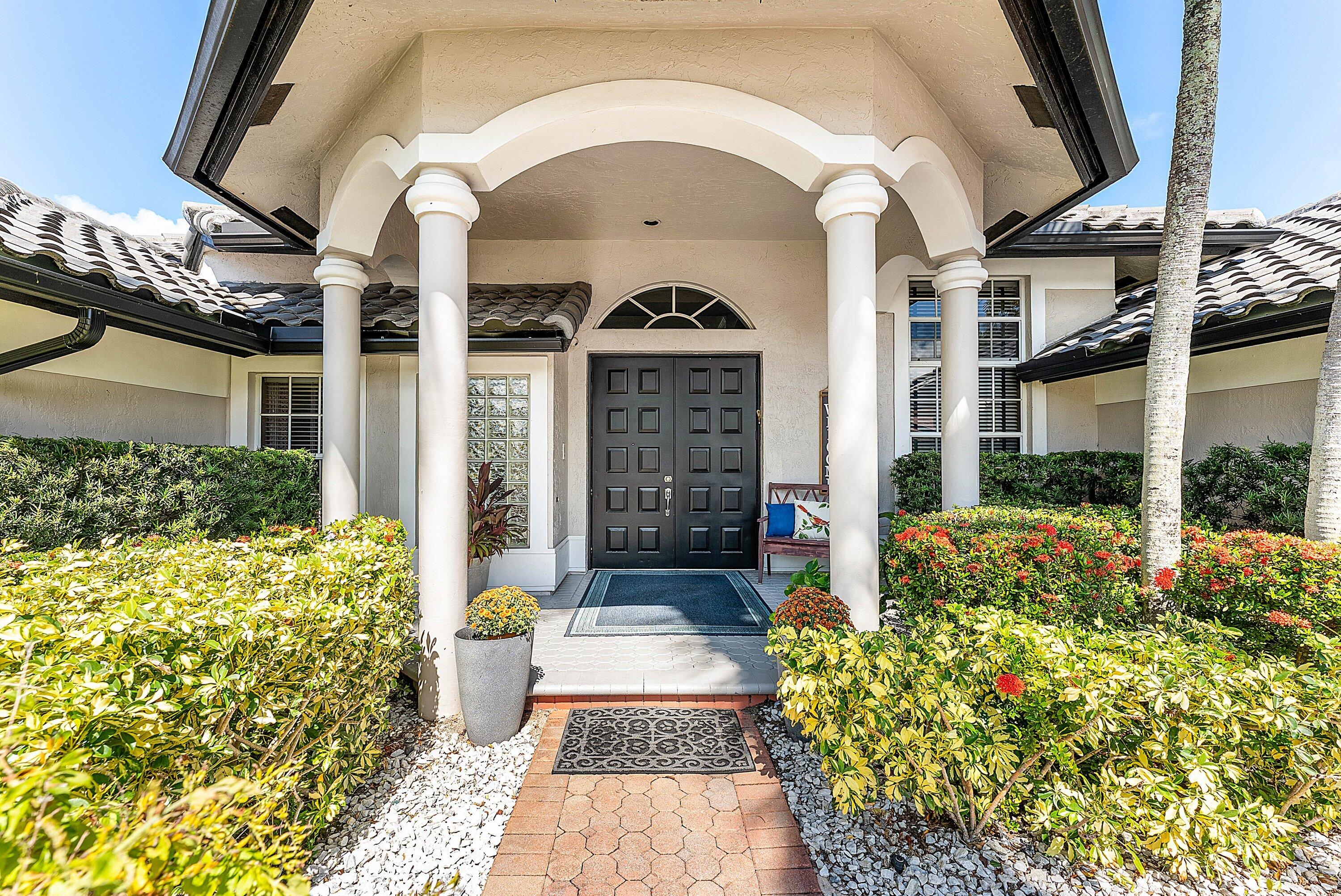 Opportunity to own this popular Cayman V model on highly sought-after oversized, pie-shaped cul-de-sac lakefront lot in gated community. Welcoming double door entry. Volume ceilings, and many updated features throughout the home, roof 2022 - come see! Spacious primary suite opening to upgraded pool and spa, adjacent bedroom can serve as study w/three more bedrooms on the other side. Generously-sized kitchen overlooks spacious family room with breakfast nook - great view of the pool! Expansive covered patio, perfect for relaxing while enjoying the stunning views of the lakefront. Convenient cabana bath. This gated community offers many amenities, including clubhouse with many activities: fitness center, resort-style pool and spa, playground, tennis and basketball courts.