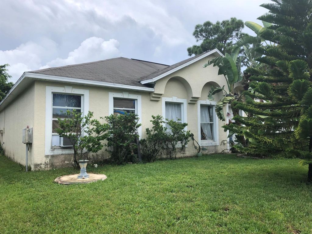 Photo of 834 SE Cavern Avenue Ave, Port St Lucie, FL 34983 (MLS # R10737873)