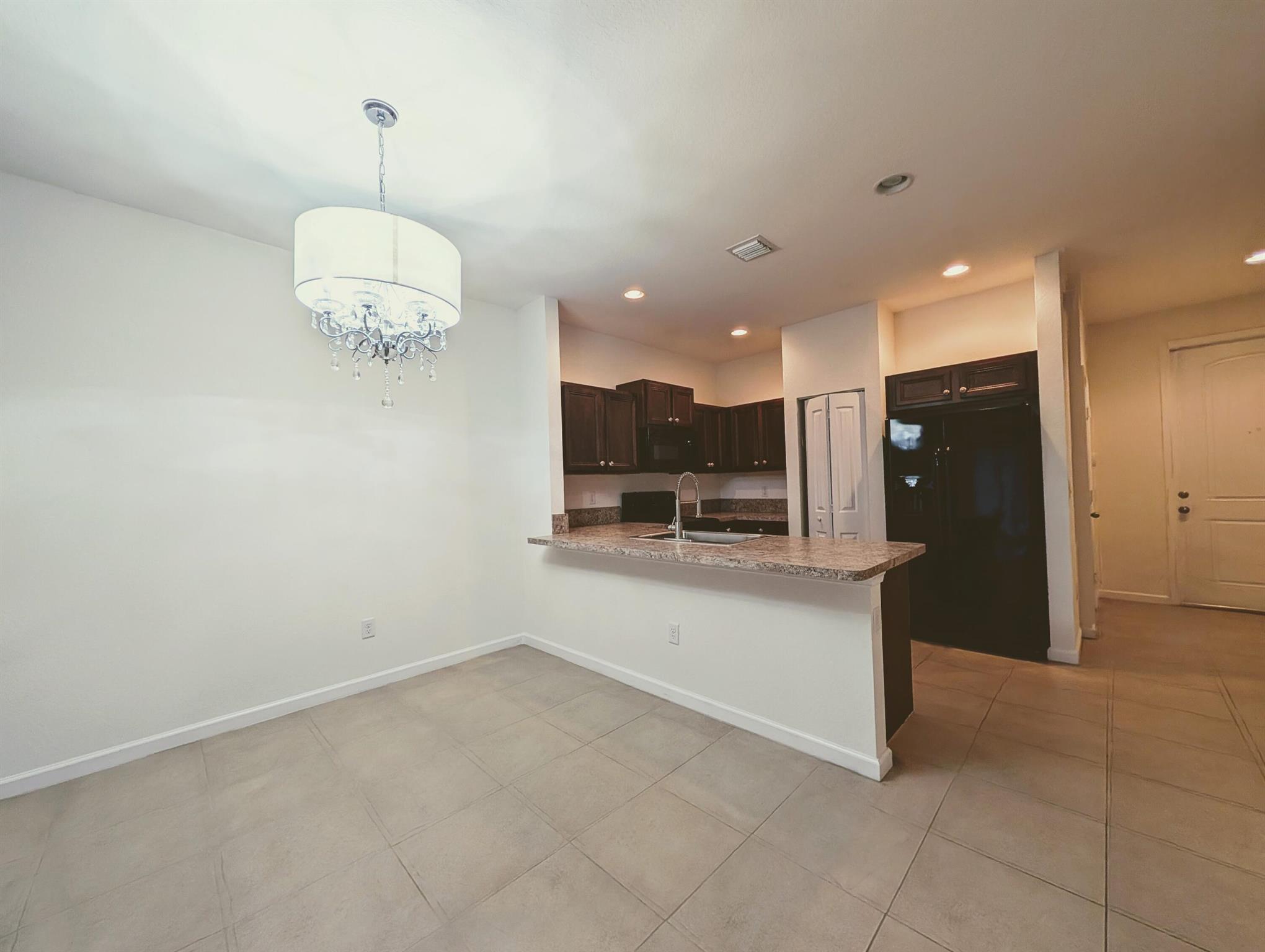 PRICE REDUCED-READY TO MOVE IN, after HOA QUICK approval. A Beautiful Comfortable, spacious townhouse with high ceilings, large living area. New kitchen and appliances, tile floor on living area on main floor, back patio with a beautiful garden view. With 3 spacious bedrooms on the 2nd floor: a spacious master bedroom with a walking closet, a 2nd closet and a master bathroom with shower, cabinet and linen closet. Second bathroom with tub and 2 more bedrooms. Washer/ Dryer closet. The one car garage has a cabinet and storage area, extended driveway for one more car. Hurricane shutters. Private street. Easy access to main highways (I-95 and Sawgrass), shops, supermarkets & entertainment. Close to schools, hospital and a short drive to Deerfield Beach Pier and beach area.