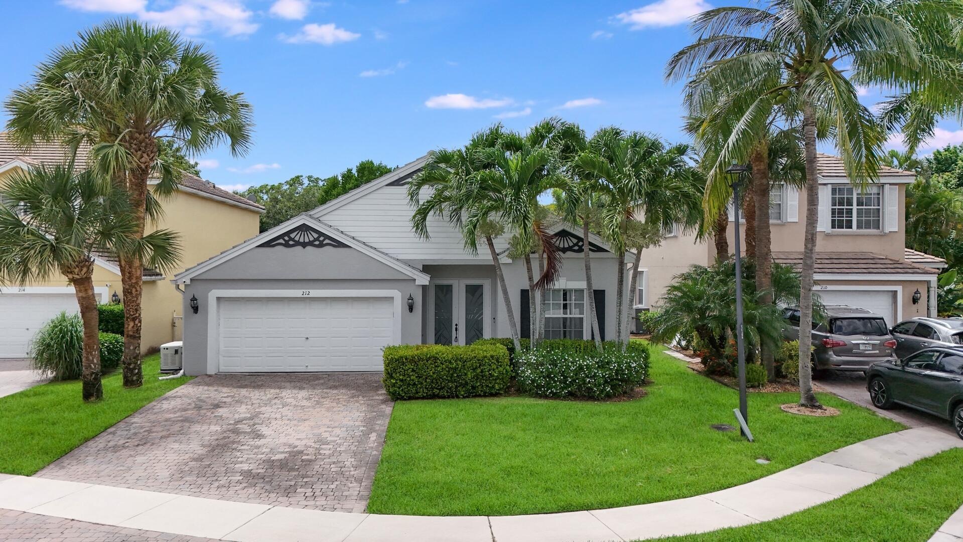 Welcome to this beautifully maintained home in a gated community just off 441--where convenience meets comfort! Step into a spacious living and dining area that flows seamlessly into the kitchen, featuring white cabinetry, a double farmhouse sink, and a custom range hood. The adjacent family room offers a cozy gathering space, accented by ceiling fans throughout the home for year-round comfort.The home includes a dedicated laundry room and a 2-car garage, plus a newer washer and dryer for added convenience. The guest bathroom is absolutely gorgeous, boasting a tub/shower combo with stylish finishes.The primary suite is a true retreat, offering tray ceilings, dual walk-in closets, a soaking tub, and a separate shower.Outdoors, relax or entertain in your private backyard