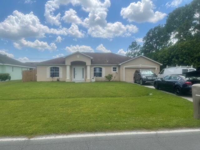 Photo of 2322 SW Import Drive, Port Saint Lucie, FL 34953 (MLS # R10743814)