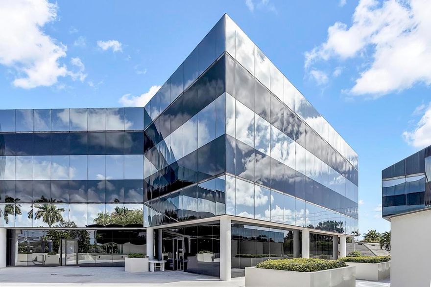 Office, medical use and or food services space at the Sanctuary Centre Professional building. Prime East Boca location at the intersection of Yamato Road and N. Federal Highway. This is a 987 square foot 1st floor unit with interior and exterior access. Formerly an operating restaurant, the unit boasts a kitchen (no vent hood) and dining area with two AC units. The kitchen is partially equipped with refrigerators, freezers, triple sinks, ovens, and cabinets. The space could again serve as a limited service restaurant or easily be converted to a business office. Public restrooms are a short walk down the hall. A large plaza area outside.