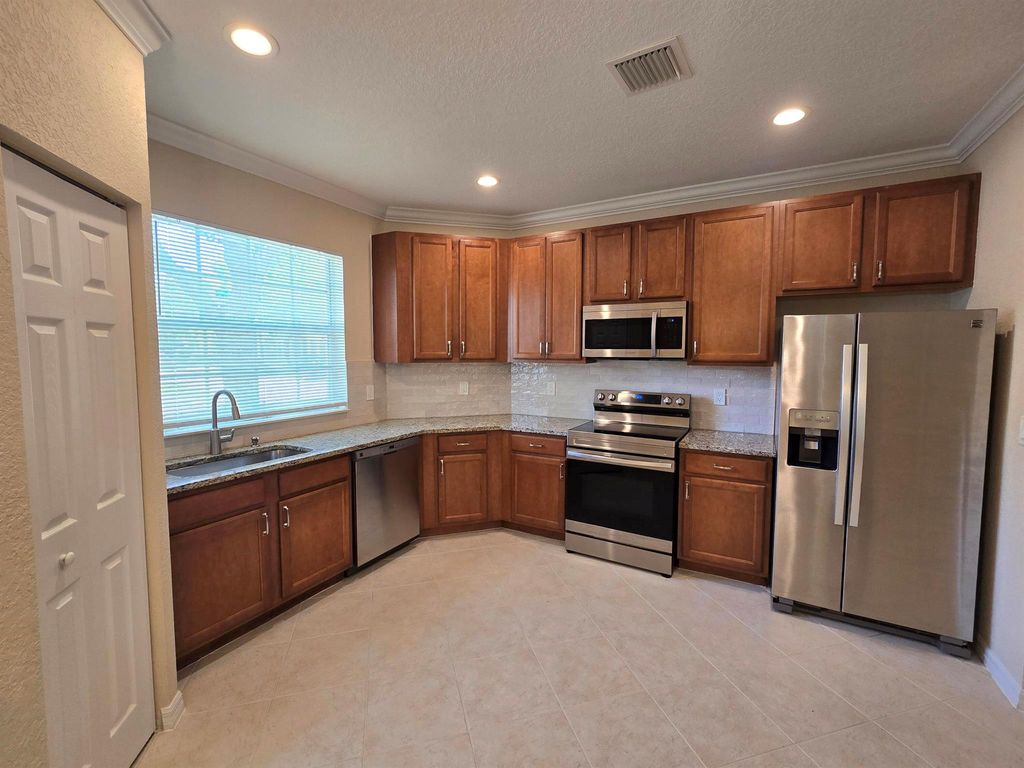 Photo of 2049 SE June Park Drive, Port Saint Lucie, FL 34952 (MLS # R11013300)