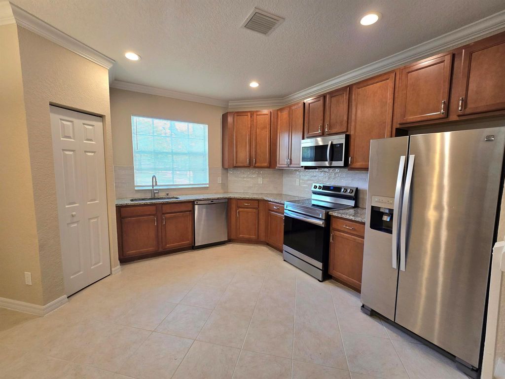 Photo of 2049 SE June Park Drive, Port Saint Lucie, FL 34952 (MLS # R11013300)