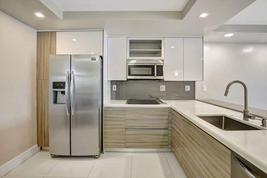 FULLY REMODELLED WITH LUXURIOUS UPGRADES 2/2 WATERFRONT CONDO WITH DOCK OPTION. UPGRADES INCLUDE: REMODELLED KITCHEN AND BATHROOMS, NEW TILE FLOORING, NEW ELECTRICAL, NEW TANKLESS WATER HEATER, NEW LIGHT FIXTURES, NEW DOORS, CLOSET BUILT INS AND MUCH MORE!!! A+++ LOCATION WITHIN 10 MINUTES TO SUNNY ISLES BEACH, AVENTURA MALL, OLETA STATE PARK, SHOPPING CENTER AND MAJOR HIGHWAYS. RESORT STYLE AMENITIES INCLUDING POOL, GYM AND GAME ROOM. GORGEOUS WATERVIEW!!!! SELLER PAID OFF ASSESSMENTS!!!! The new owner will enjoy the beefit of a new balconies, nrenovated parking lot, new seawall and having a freshly painted building!