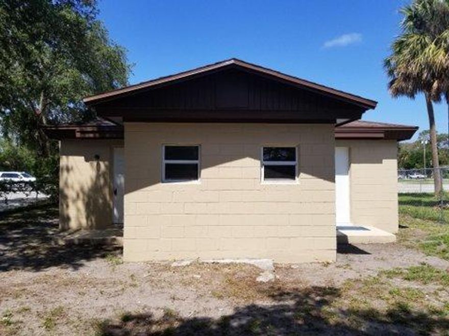 cozy 2/1 with tile main area laminate in bedrooms. 2 window AC units in bedrooms. all appliances and centrally located includes stackable washer and dryer for unit use.