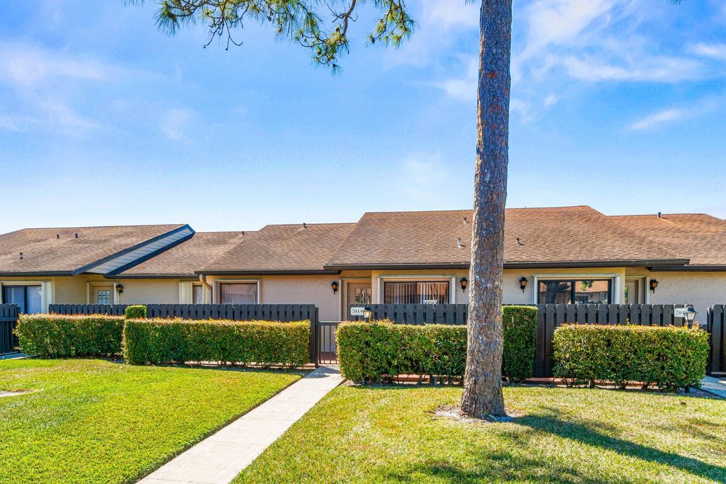 Photo of 704 Sunny Pine Way #C, Greenacres, FL 33415 (MLS # R11167306)