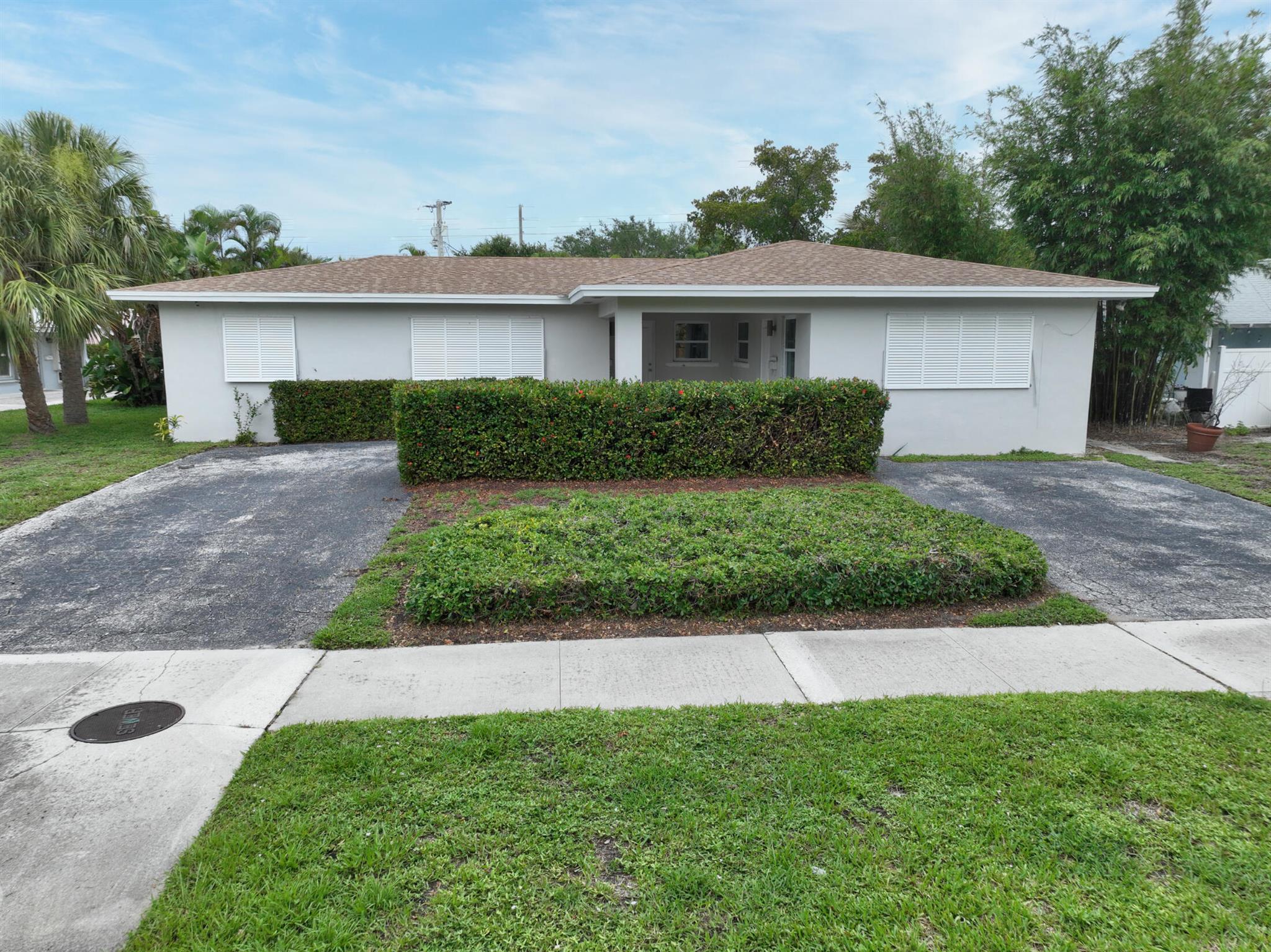 Great investment opportunity for you in the heart of North Palm Beach OR room for the entire family and then some. 2BR 2 BA single family home and a duplex with a 2/1 and 1/1. New HVAC units. New mostly all impact windows. New flooring. Some updates done with minimal left to do Add to your decorative style. Great outdoor space and plenty of parking for all. Each unit with a separate electrical and water meters. Live in the home and collect the rent from the duplex OR have the entire family stay onsite. Many options at this price. Close to all that NPB has to offer. Schedule your showing today