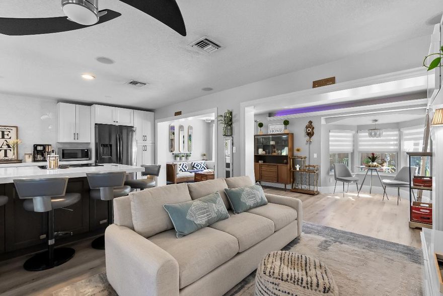 Welcome to your winter escape at 1605 Treemont Ave, Jupiter, FL, where paradise is just a click away... and who knows, you may just want to stay forever!

This one-of-a-kind seasonal rental places you right in the heart of everything that makes Jupiter irresistible. Nestled in a walkable, friendly neighborhood, this home is just steps from the Intracoastal Waterway, perfect for a morning stroll or bike ride. Bring/Rent a paddleboard or kayak and head over to the nearby boat drop on Riverside Drive for a laid-back day on the water, or cruise out to the sandbar at low tide and soak up the true South Florida lifestyle. Offering Queen bed in Primary Room and Full in Secondary (Optional Queen Bed if needed)
Feeling adventurous? Grab a bike rental from a local bike shop and head over to Jonathan Dickinson State Park for some of the best mountain biking in South Florida. Prefer the water? Launch a kayak and glide through the park's scenic waterways keep your eyes open, you may even catch a glimpse of a Florida alligator (don't be scared... true Floridians do it all the time!). The park also offers camping and glamping, making it an unforgettable outdoor experience just minutes from home.

Back at the house, outdoor living truly shines. Spend crisp 60-degree winter evenings roasting marshmallows by the backyard fire-pit, challenge friends to yard games on the lush artificial turf, and enjoy the glow of **party lights** overhead. The expansive front deck is the perfect spot to sip your morning coffee or unwind at sunset with your favorite bottle of wine.

Nature lovers and families will appreciate the 6-acre neighborhood park directly behind the home, featuring winding pathways, open green space, and frequent wildlife sightings. It's ideal for an afternoon walk, playing ball with the kids, or simply enjoying the Florida sunshine.

When it's time for a treat or night out, take a short walk to Gallery Square and enjoy handcrafted coffee at Perk Coffee Roasters, ice cream from Sloan's Ice Cream, or local favorites like Gallery Grill, Locals Pub, Salty Zebra, & Copacabana Cuban Cuisine. Catch a football game, meet friends, or enjoy the vibrant local sceneall without getting in the car. The best part? It's all walkable.

And of course, the beach is only a 5 minute drive away, with free parking, making spontaneous ocean days effortless and stress-free. With morning sunrises to die for! Don't miss out on Blowing Rocks spectacle of what spouts through the rocks of over 50 feet at times!

This is more than a seasonal rental, it's a lifestyle. A rare opportunity to spend the winter months surrounded by water, nature, walkability, and sunshine. A truly unique property for enjoying winters in South Florida.
Come experience why winter is better in Jupiter.