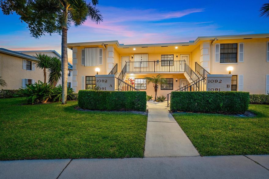 Custom remodeled and upgraded first floor end unit located between 5th and 6th holes at The Golf Club of Jupiter overlooking the Lake! Split Open Concept floor plan, private guest suite and full bath in front, a spacious primary in back with zero entry shower. Enjoy a completely remodeled kitchen with huge island, perfect for entertaining! Impact windows throughout & electric hurricane screen for back porch. Laundry is renovated with additional storage space. New 2025 Roof!  Enjoy the privacy and extra natural light of an end unit & the convenience of first-floor living, along with beautiful sunset views! New saltwater pool and active clubhouse! Take advantage of the central location near everything Jupiter has to offer!