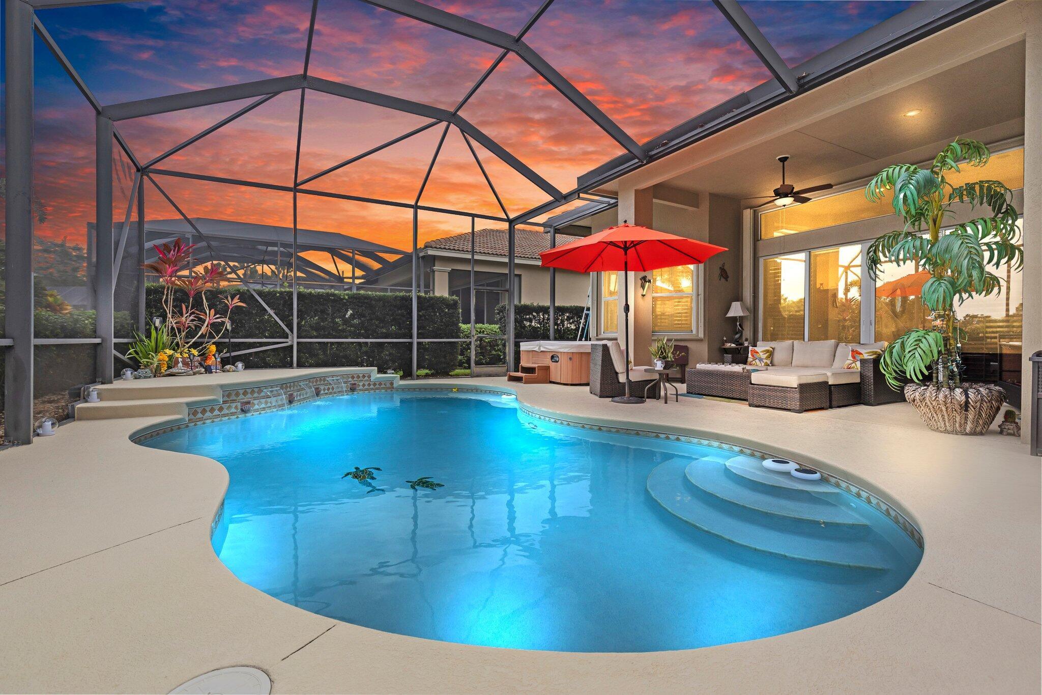 Stunning lakefront 3BR/3BA pool home with den in sought-after PGA Village! Enjoy serene water views, a private heated pool with screened lanai, and a golf cart garage with its own door and parking pad. Inside, find a gourmet kitchen with double ovens, gas cooktop, granite counters, and rich wood cabinetry. The spacious open layout includes a large den, perfect for an office or guest space. Additional upgrades include full-house water filtration, whole-house dehumidifier, and impact windows. Located in a gated, amenity-rich community with only county taxes--no city tax!
