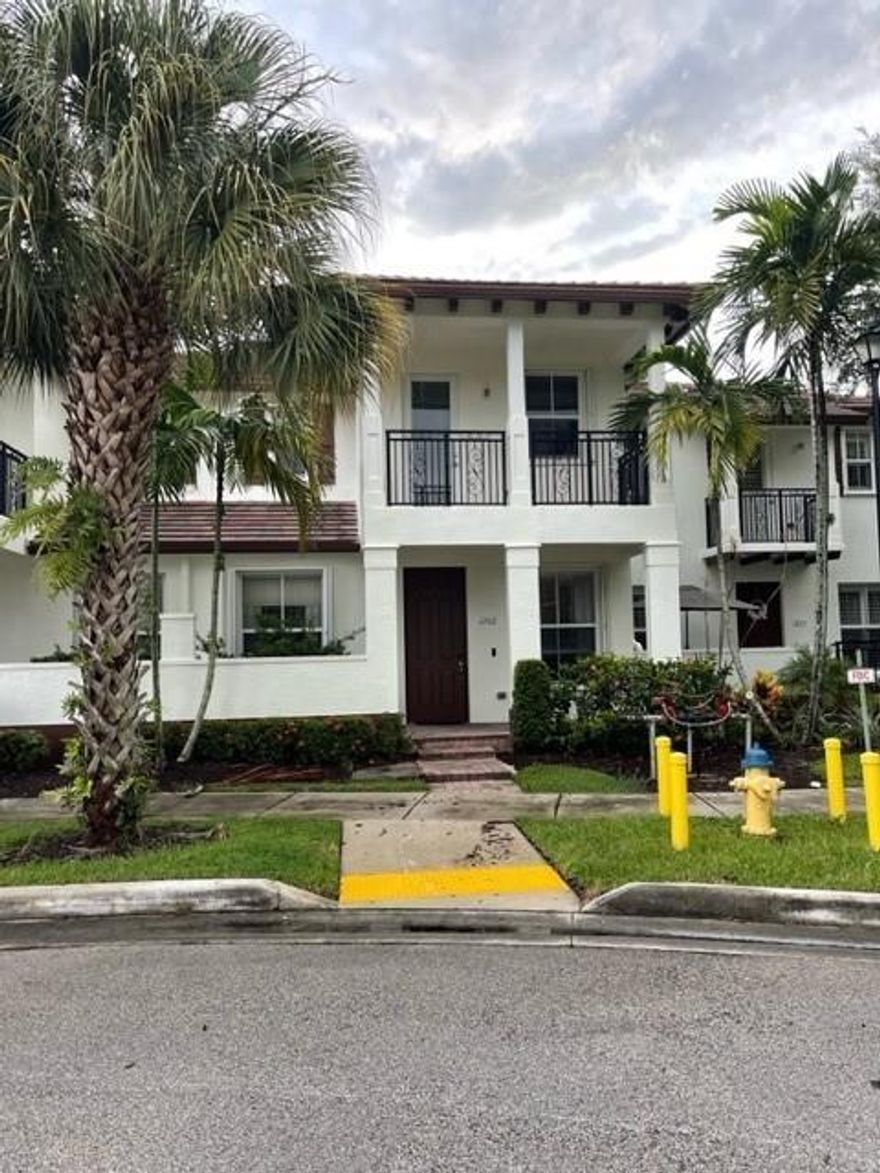 Live your best life at Paloma Lakes. Walking distance to The Promenade at Coconut Creek - a premier open air shopping and dining experience, featuring over 36 stores and boutiques, 14 restaurants and Silverspot Cinema. This 3 bedroom 2.5 bathroom spacious townhouse has brand new carpet upstairs and tile throughout. It has a 2 car garage, and balconies with hurricane impact doors. Also upstairs is a full size laundry room! Master suite features separate shower and tub, with dual sinks and even separate his and hers walk-in closets.