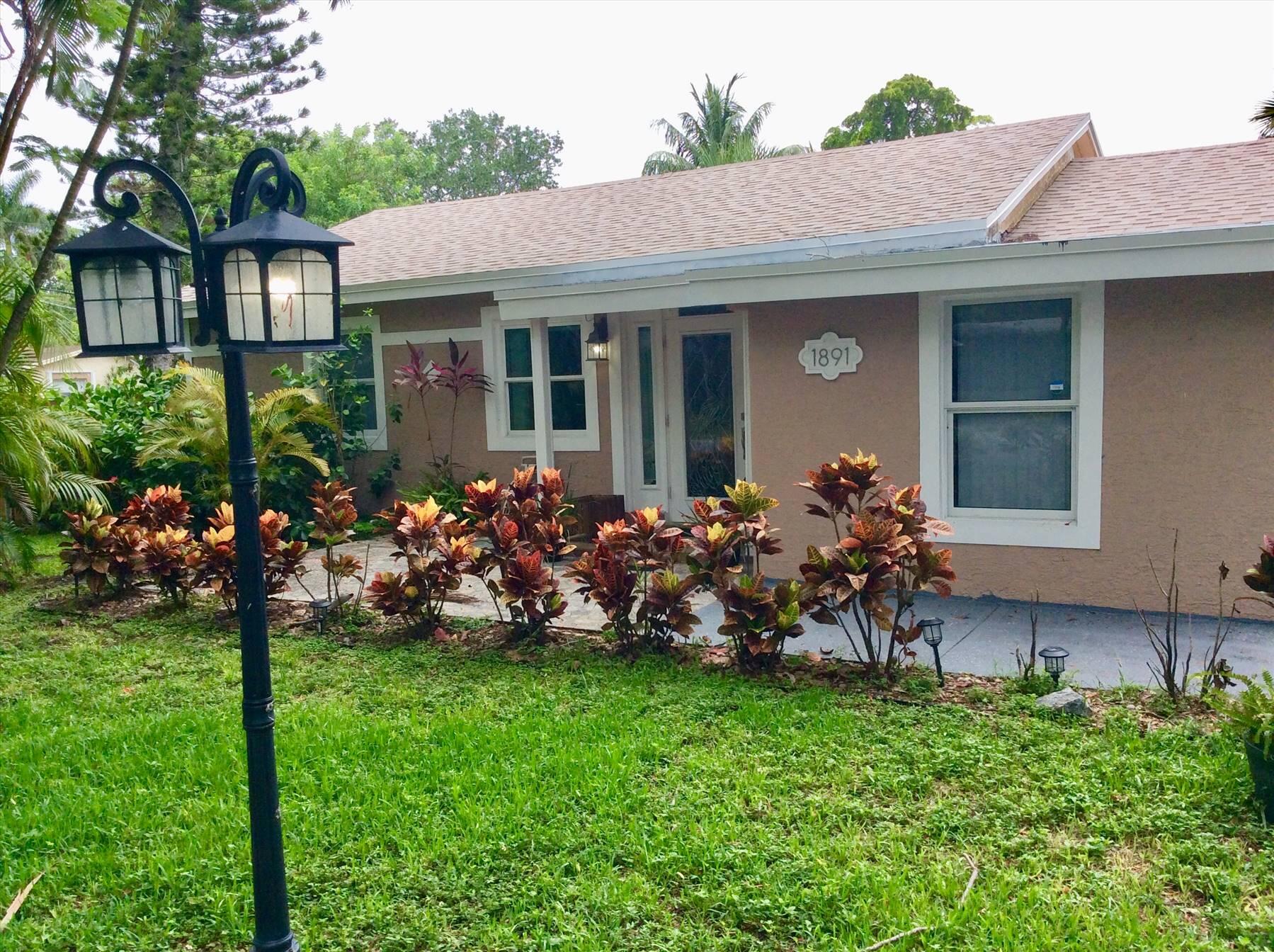 This beautiful 3-bedroom, 2-bathroom home is in excellent condition and sits on a spacious double corner lot, perfect for entertaining WOW! The open floor plan and modern custom design show a meticulous attention to detail. The primary bathroom features a large 7-foot double vanity and a huge walk-in closet. The kitchen boasts white shaker cabinets and an eat-in island. For added peace of mind, all windows are impact-rated, and the front door is made of impact-rated stained glass. This house was thoughtfully customized by its owners, and you will appreciate its high-quality features. Going quick at $2975.00 AVAILABLE September 30th.